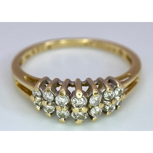 394 - A 14K YELLOW GOLD 2 ROW DIAMOND RING. 0.25ctw, size N, 2.3g total weight. Ref: SC 9029