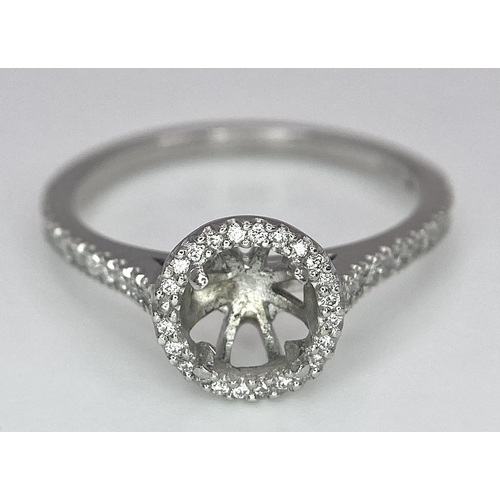 142 - A PLATINUM DIAMOND SET HALO AND SHOULDERS RING MOUNT 0.40CT, READY TO SET YOUR DREAM GEMSTONE 4.3G S... 