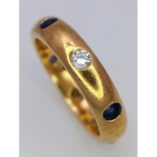 26 - A 18K YELLOW GOLD DIAMOND & SAPPHIRE SET BAND RING 0.20CT DIAMONDS & 0.25CT SAPPHIRES 5.5G SIZE K.

... 