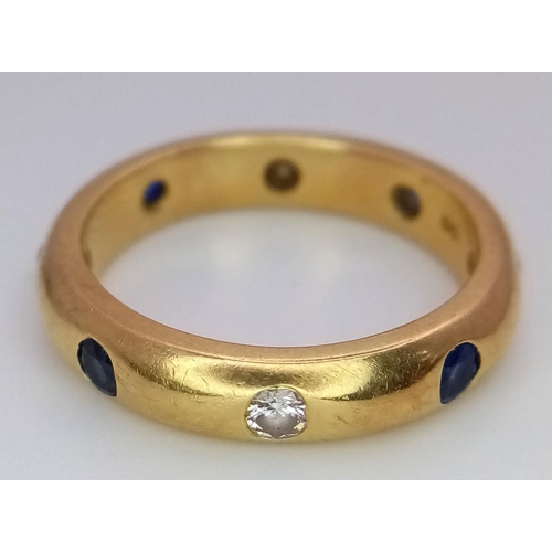 26 - A 18K YELLOW GOLD DIAMOND & SAPPHIRE SET BAND RING 0.20CT DIAMONDS & 0.25CT SAPPHIRES 5.5G SIZE K.

... 