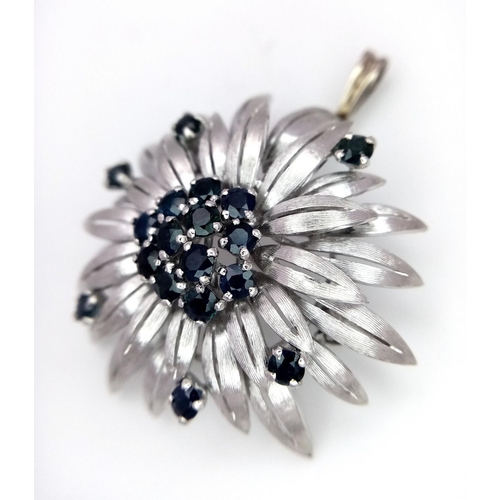 33 - A 14ct white gold (tested as) sapphire flower brooch that has a bail that can be worn as a pendant (... 