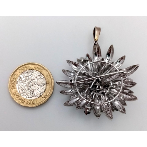 33 - A 14ct white gold (tested as) sapphire flower brooch that has a bail that can be worn as a pendant (... 