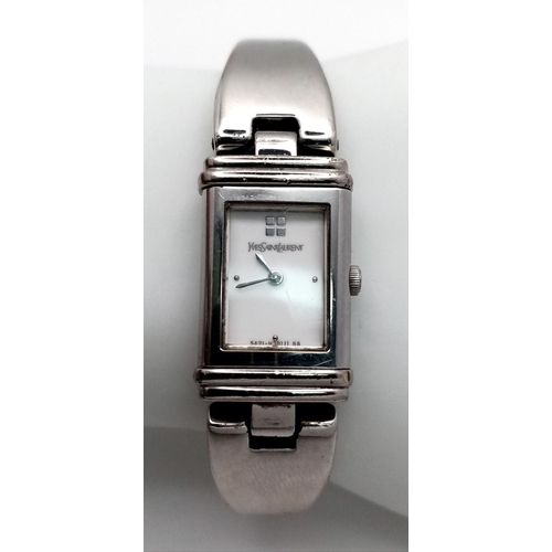 373 - An Yves St Laurent Designer Reverso Quartz Ladies Watch. Stainless steel bracelet and case - 15mm. W... 