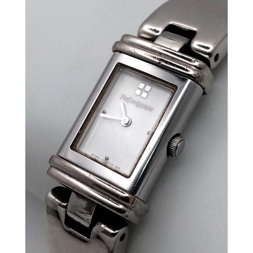 373 - An Yves St Laurent Designer Reverso Quartz Ladies Watch. Stainless steel bracelet and case - 15mm. W... 