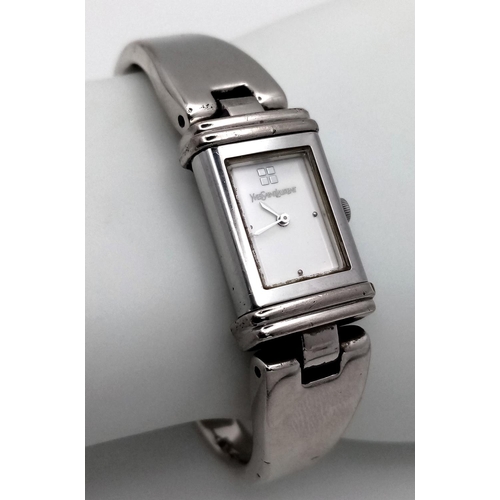 373 - An Yves St Laurent Designer Reverso Quartz Ladies Watch. Stainless steel bracelet and case - 15mm. W... 