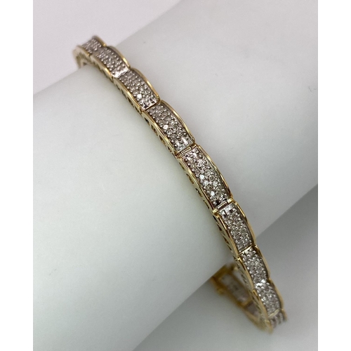 68 - A 9K YELLOW GOLD DIAMOND SET BRACELET 1CT 10.1G , 18.8cm length.

SC 9027