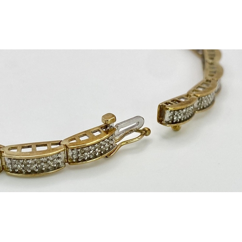 68 - A 9K YELLOW GOLD DIAMOND SET BRACELET 1CT 10.1G , 18.8cm length.

SC 9027