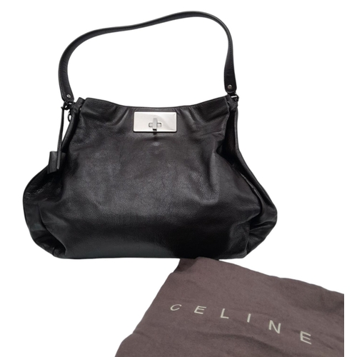 123 - A Celine Dark Brown Shoulder Bag. Leather exterior with silver-toned hardware, single strap, press s... 