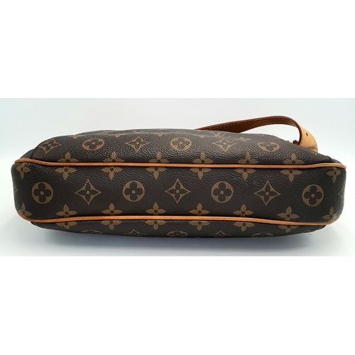 130 - A Louis Vuitton Thames Shoulder Bag. Monogramed canvas exterior with gold-toned hardware, adjustable... 