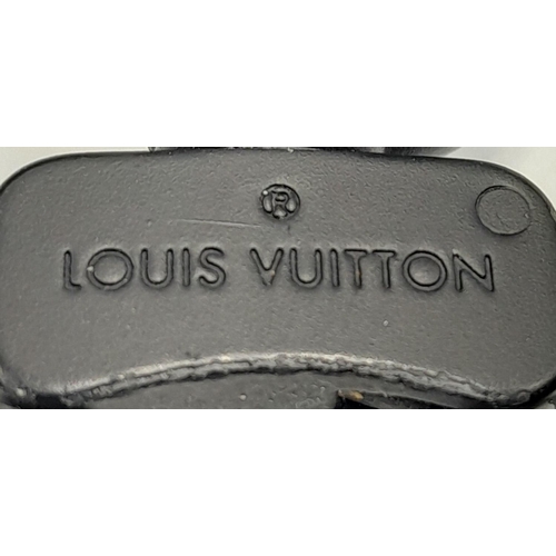 2 - A Louis Vuitton Black Eclipse Trunk Messenger Bag. Monogramed canvas exterior with black-toned hardw... 