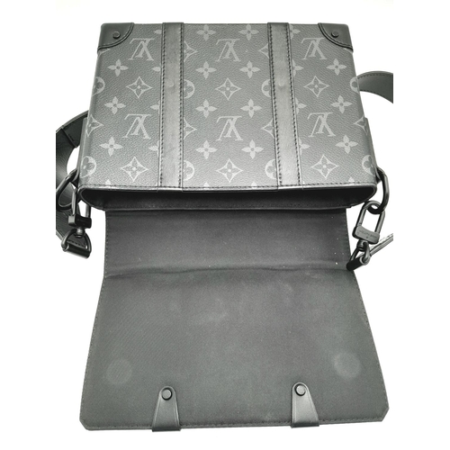 2 - A Louis Vuitton Black Eclipse Trunk Messenger Bag. Monogramed canvas exterior with black-toned hardw... 