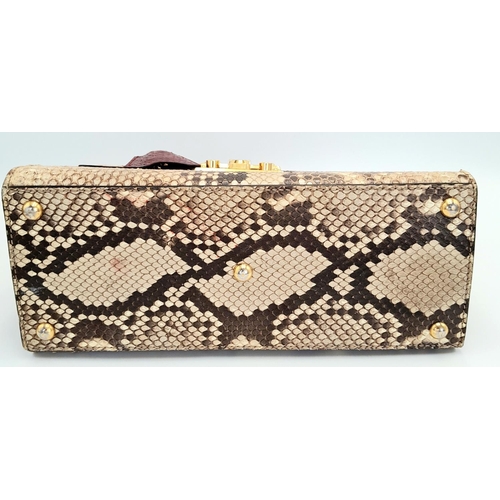 201 - A Gucci Multi-Colour Python Padlock Bag. Python skin and leather exterior with gold-toned hardware, ... 