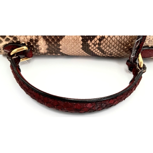 201 - A Gucci Multi-Colour Python Padlock Bag. Python skin and leather exterior with gold-toned hardware, ... 