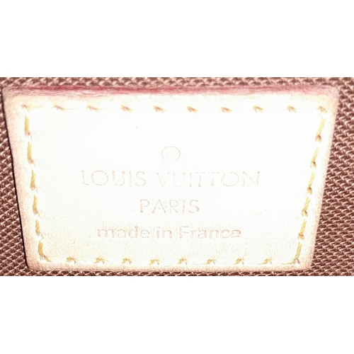 215 - A Louis Vuitton Trotteur Beaubourg Satchel Bag. Monogramed canvas exterior with gold-toned hardware,... 