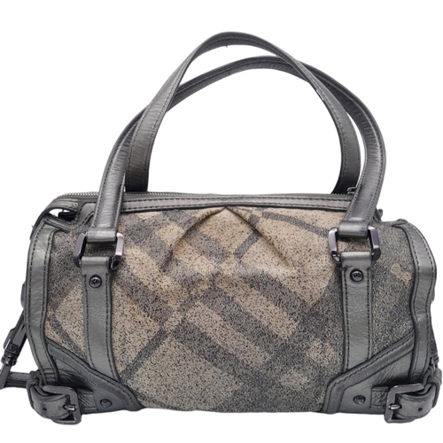 226 - A Burberry Metallic Grey Smoke Check Bag. Canvas exterior with leather trim, leather straps, black-t... 