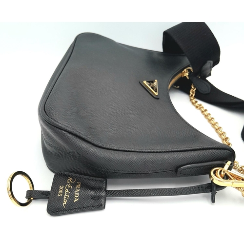 23 - A Prada Black Re-Edition 2005 Bag. Saffiano leather exterior with gold-toned hardware, zip top closu... 