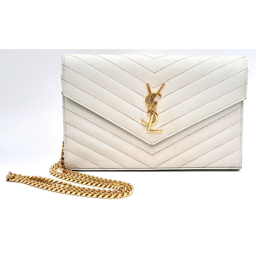 58 - A YSL Ivory Cassandre Wallet Bag. Leather exterior with gold-toned hardware, the iconic YSL logo, re... 