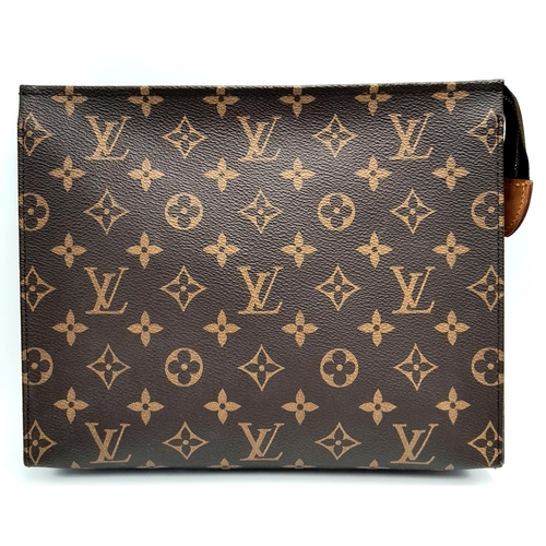 72 - A Louis Vuitton Toiletries Pouch. Monogramed canvas exterior with gold-toned hardware and zipped top... 