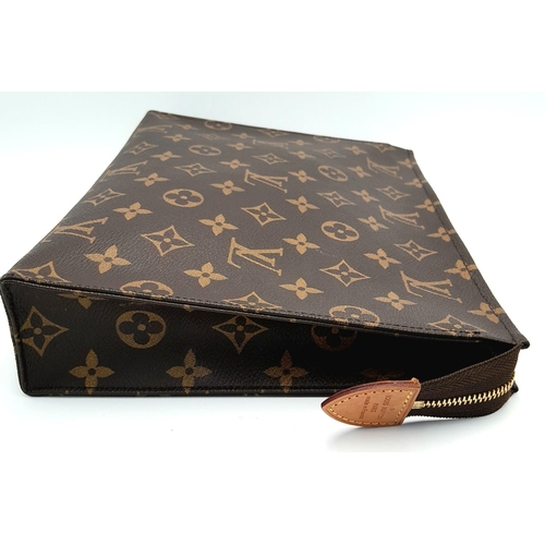 72 - A Louis Vuitton Toiletries Pouch. Monogramed canvas exterior with gold-toned hardware and zipped top... 