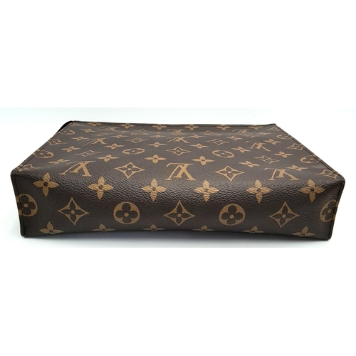 72 - A Louis Vuitton Toiletries Pouch. Monogramed canvas exterior with gold-toned hardware and zipped top... 