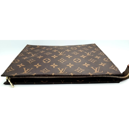 72 - A Louis Vuitton Toiletries Pouch. Monogramed canvas exterior with gold-toned hardware and zipped top... 