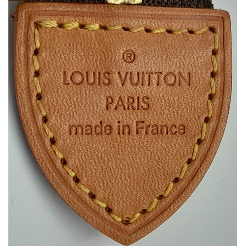 72 - A Louis Vuitton Toiletries Pouch. Monogramed canvas exterior with gold-toned hardware and zipped top... 