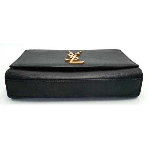 79 - A Saint Laurent Black Kate Crossbody Bag. Leather exterior with gold-toned hardware, the iconic YSL ... 