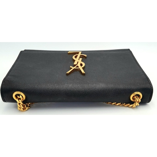 79 - A Saint Laurent Black Kate Crossbody Bag. Leather exterior with gold-toned hardware, the iconic YSL ... 