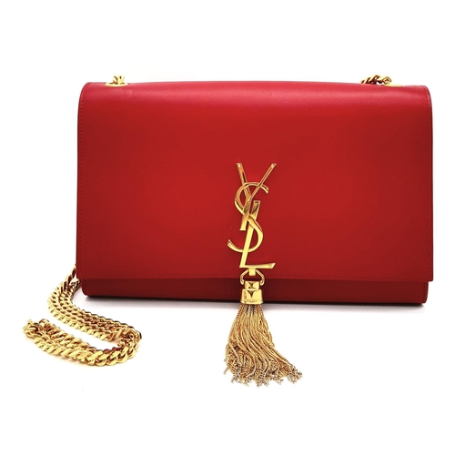 9 - A YSL Red Kate Tassel Crossbody Bag. Leather exterior with gold-toned hardware, the iconic YSL logo,... 