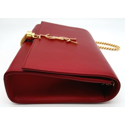 9 - A YSL Red Kate Tassel Crossbody Bag. Leather exterior with gold-toned hardware, the iconic YSL logo,... 