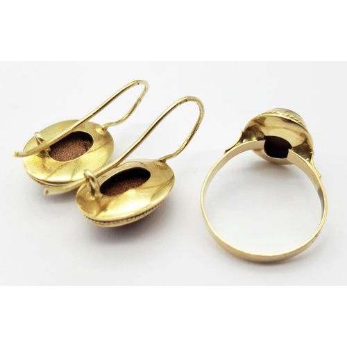 281 - A 9 K yellow gold set of ring and earrings with 