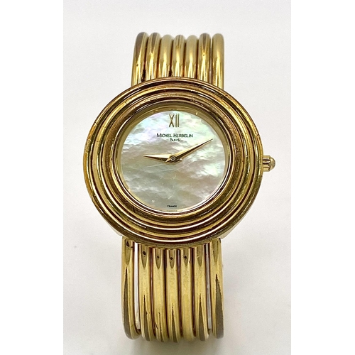 353 - A Michel Herbelin Gold Plated Quartz Ladies Watch. Circular case diameter - 32mm. Mother of pearl di... 