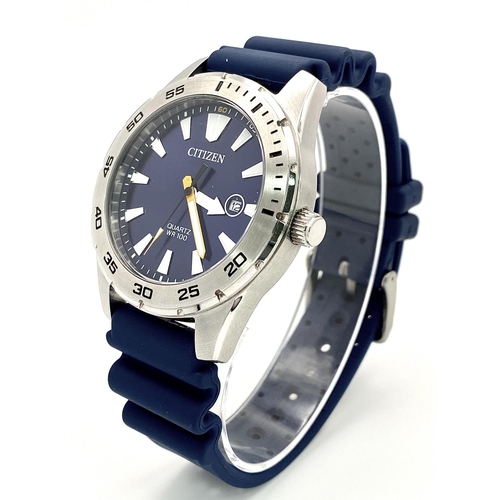 500 - A Citizen Quartz Gents Watch. Blue rubber strap. Stainless steel case - 42mm. Blue dial with date wi... 