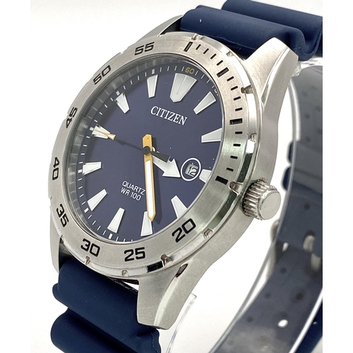 500 - A Citizen Quartz Gents Watch. Blue rubber strap. Stainless steel case - 42mm. Blue dial with date wi... 