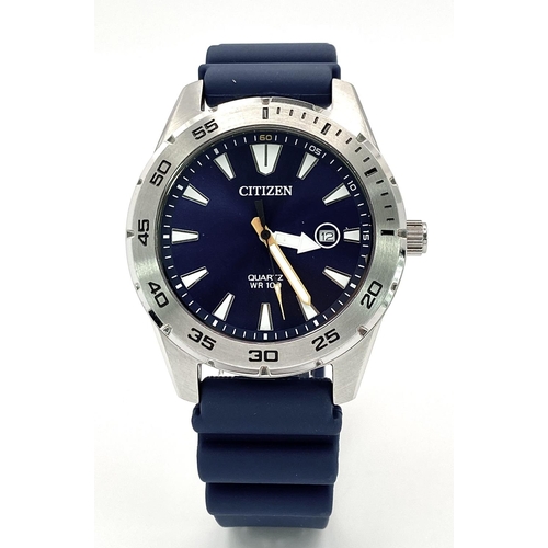 500 - A Citizen Quartz Gents Watch. Blue rubber strap. Stainless steel case - 42mm. Blue dial with date wi... 