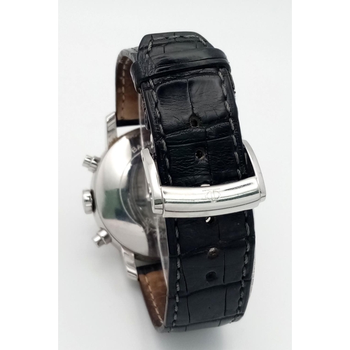 74 - A Baume and Mercier Automatic Gents Watch. Black leather strap. Stainless steel case - 42mm. White d... 