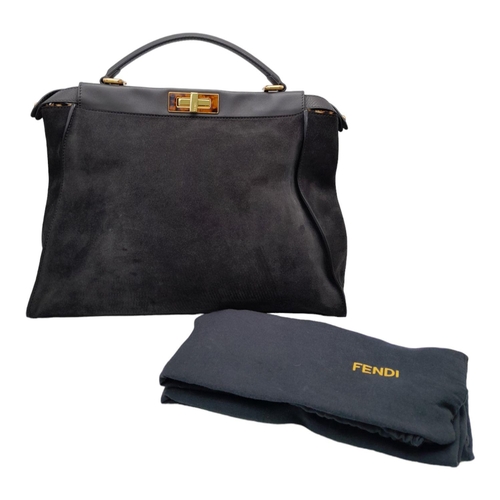 86 - A Fendi Grey Peekaboo Bag. Suede exterior with leather trim, single leather handle, gold-toned hardw... 