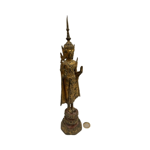 241 - An Antique 18th / 19th century Thai gilt bronze Buddha in royal dress . 13 inch tall .