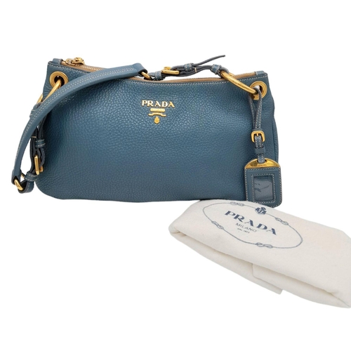 184 - A Prada Marine Blue Vitello Daino Shoulder Bag. Leather exterior with gold-toned hardware, adjustabl... 