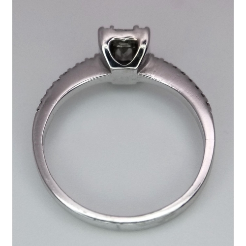 290 - An 18K White Gold, Rectangular, Baguette and Round Cut Diamond Ring. Size L 1/2. 2.8g total weight.