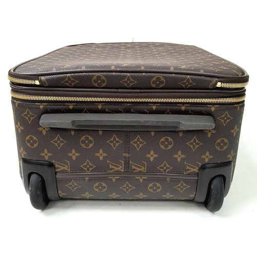 51 - A Louis Vuitton Monogram Pegase Suitcase. Durable leather exterior with gold-toned hardware. Front c... 