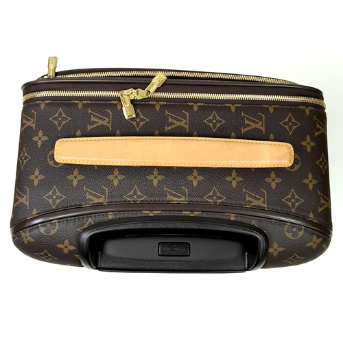 51 - A Louis Vuitton Monogram Pegase Suitcase. Durable leather exterior with gold-toned hardware. Front c... 