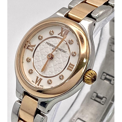 528 - A Frederique Constant Quartz Ladies Watch. Two tone bracelet and case - 28mm. White stone set dial. ... 