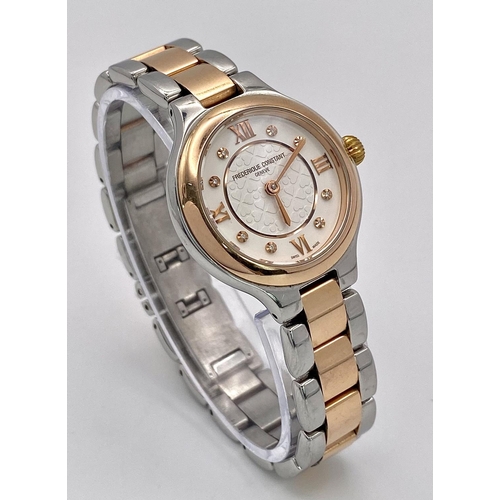 528 - A Frederique Constant Quartz Ladies Watch. Two tone bracelet and case - 28mm. White stone set dial. ... 