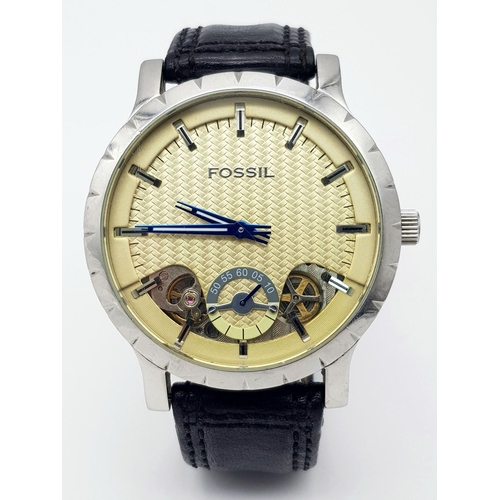 535 - A Large Cased Fossil Automatic Gents Watch. Black leather strap. Stainless steel case - 48mm. Yellow... 