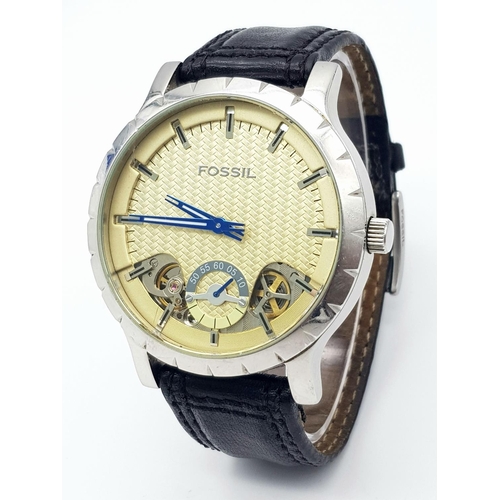 535 - A Large Cased Fossil Automatic Gents Watch. Black leather strap. Stainless steel case - 48mm. Yellow... 