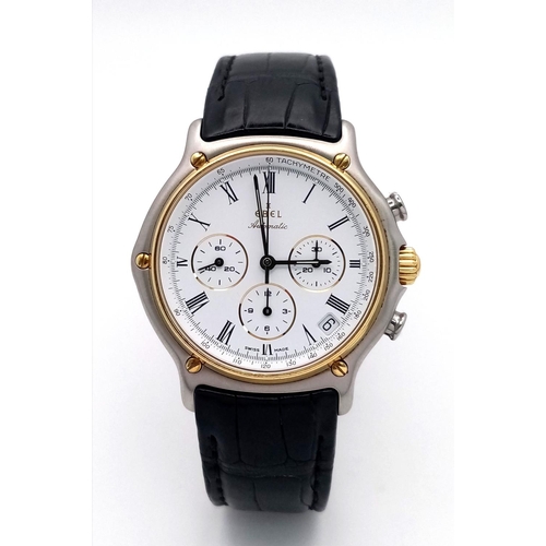 67 - An Ebel Automatic Chronograph Gents Watch. Black leather strap. Two tone case - 38mm. White dial wit... 