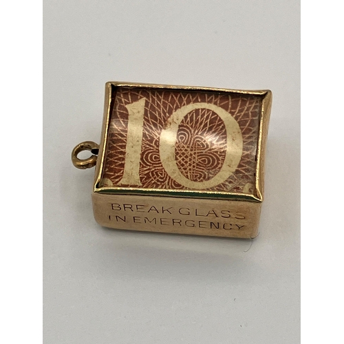 132 - Vintage 9 carat GOLD CHARM. Having a 10 Shilling Note folded inside a GOLD CASE. Full UK Hallmark. 2... 