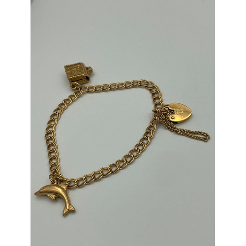 21 - 9 carat GOLD DOUBLE LINK BRACELET. Complete with safety chain and having Heart Padlock  fastening wi... 