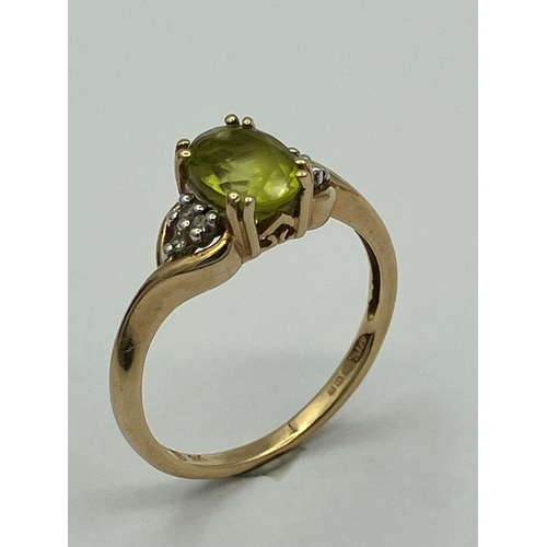 406 - QVC 9 carat GOLD and PERIDOT RING. Full UK hallmark.Complete with ring box.1.6 grams. Size J  - J 1/... 